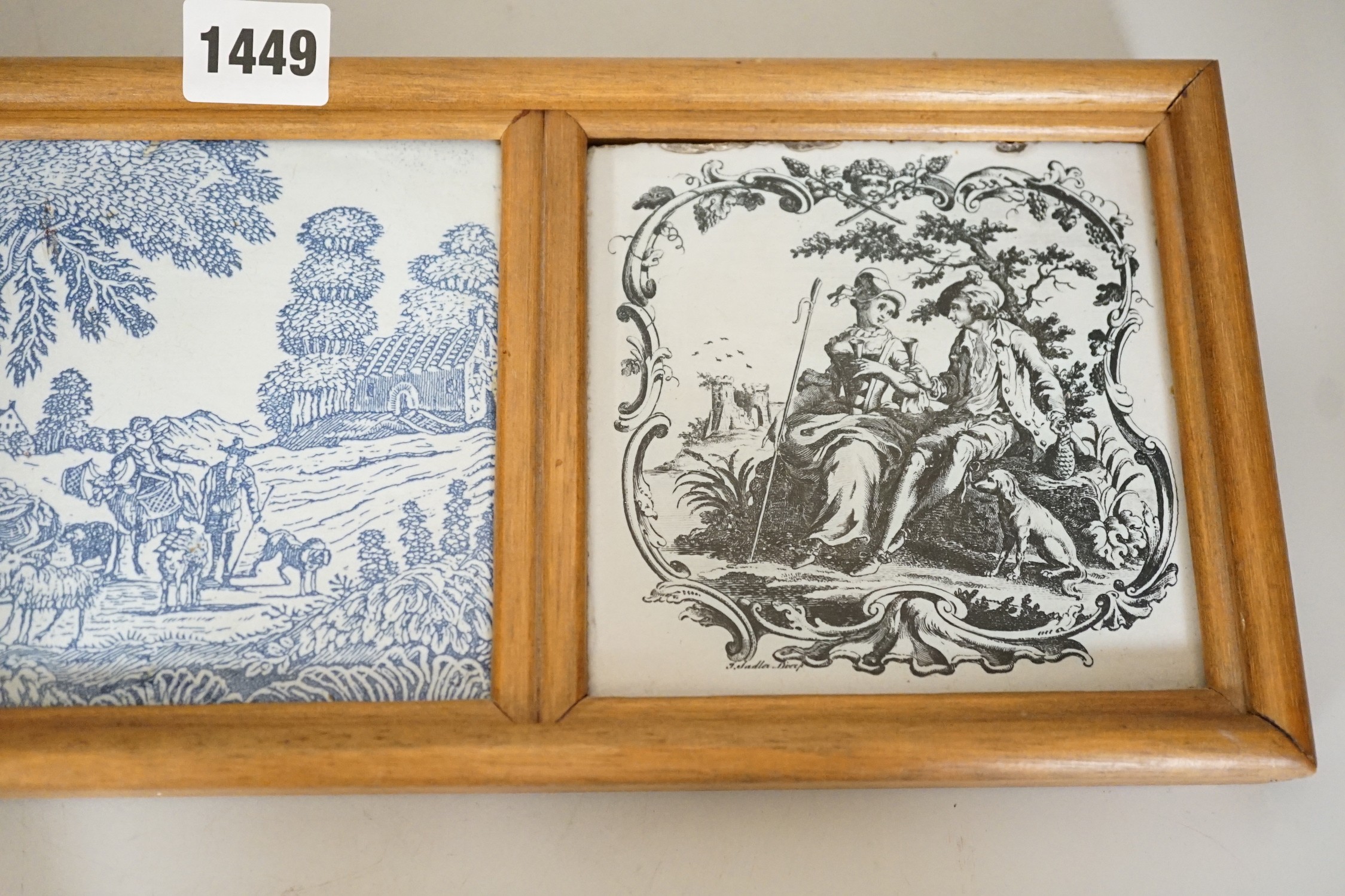 Two John Sadler Liverpool delftware black transfer printed tiles, c.1770 and a blue printed tile, in the same wooden mount. Overall 16 x 45cm
